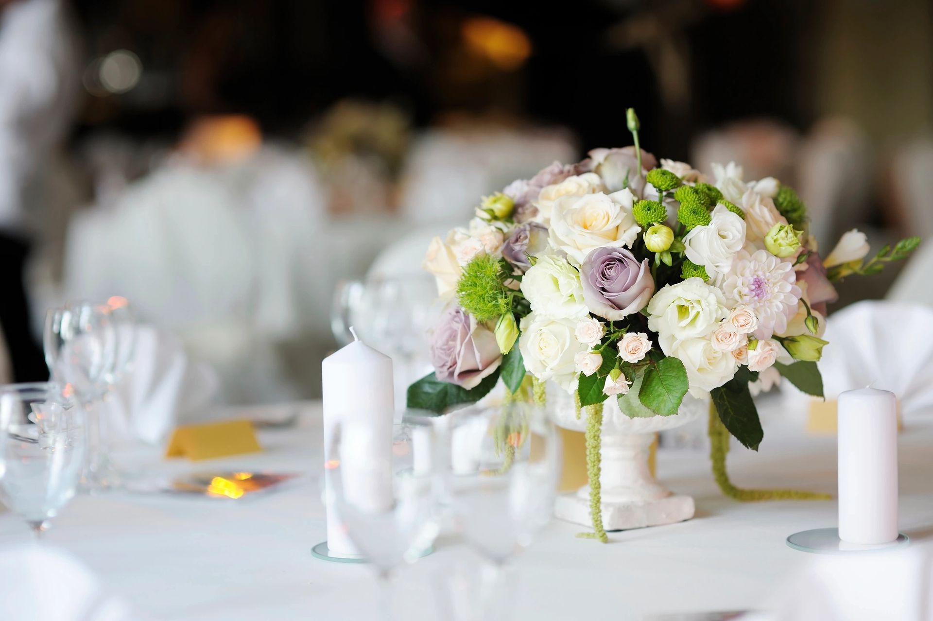 White and blush floral centerpiece at a reception